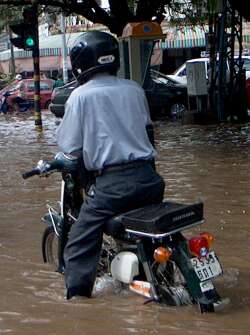 Motorcyclist stranded by flooding