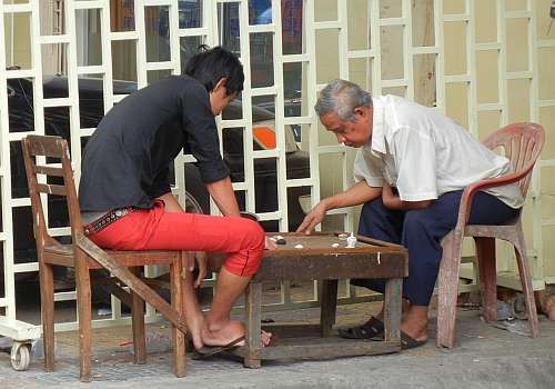Two men playing Cambodian chess