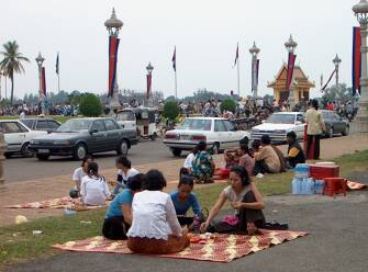 Families sitting near the river