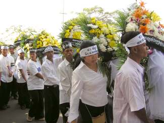 Marchers carrying flowers