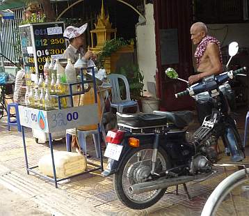 Elderly couple selling gas