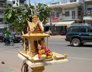 Spirit house set on a main street