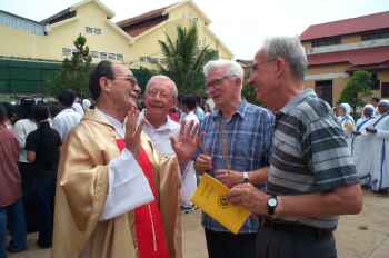 Bishop Emile Destombes with Maryknoll and Jesuit visitors