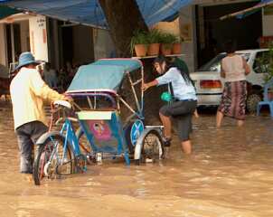 Hiring a cyclo to negotiate the floods