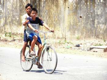 Two boys on a bike