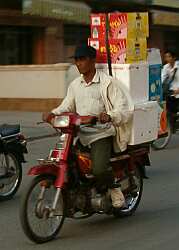 A tall load on a motorcycle