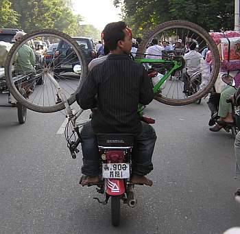 Bicycle on back of a motorcycle