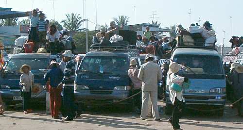 Vans full of people and goods