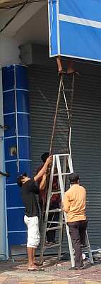 Dangerous way to use a ladder