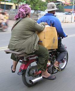 Woman on the back of a motorcycle