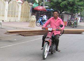 Lumber on a motorcycle