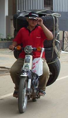 Motorcycle loaded with truck tires