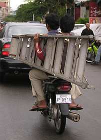 A ladder on a motorcycle