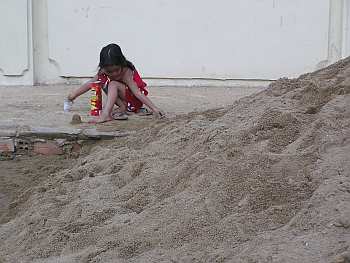 Girl playing in the dirt