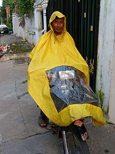 Demonstrating motorcycle raincoat