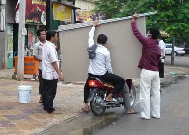 Carrying plasterboard on a motorcycle