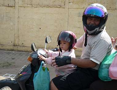 Girl with a really small helmet