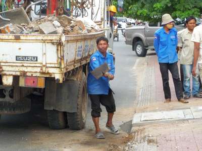 Putting in new sewer grates