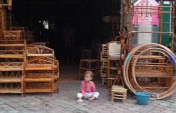 Little boy in a rattan store