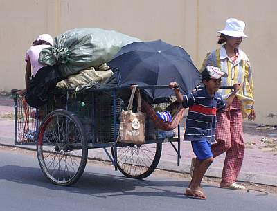 Mother and children collecting trash