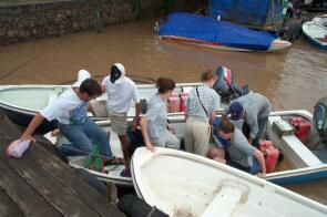 Boarding the outboard motor boat on the Mekong