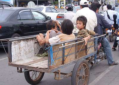 Three boys in a wagon