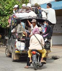 Overloaded pickup truck used as a bus