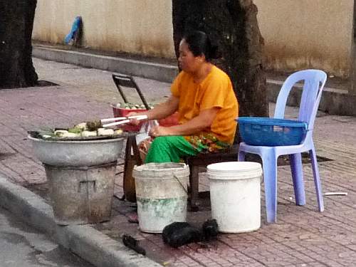 Woman frying bananas