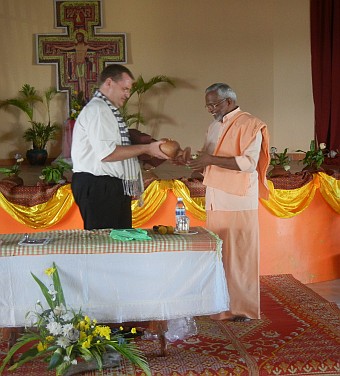 Presenting a gift to Fr. Louis