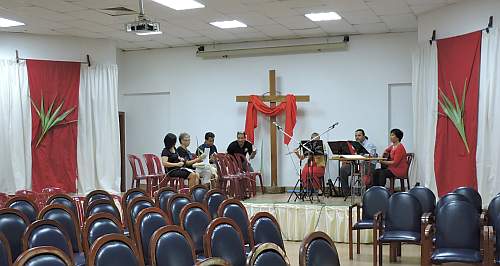 The choir practicing their music