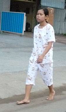 Woman in pajamas on the street