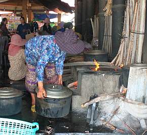 Putting a pot on the fire