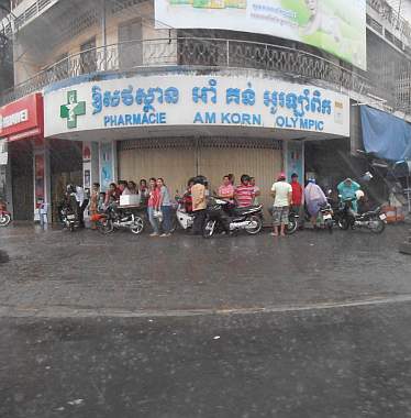 Motorcyclists sheltering from rain