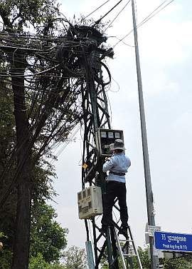 Telephone lineman on a pole