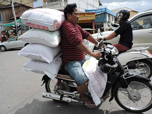 Huge load of rice on a motorcycle