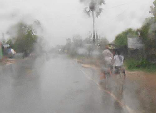 School kids riding in rain