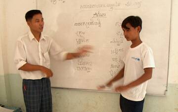 Teacher and student at the board