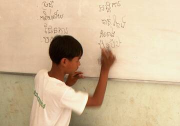 Student writing on the board