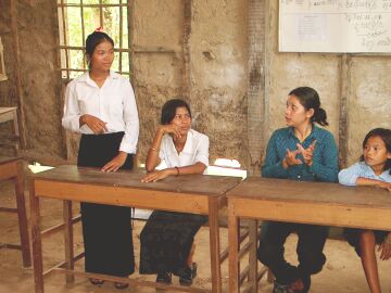 A student stands to give an answer