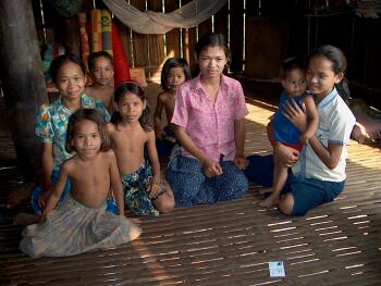 A deaf girl with her sisters and neighbor kids