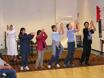 Malaysian group singing a song in signs