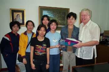 Students giving a gift to Sean Burke