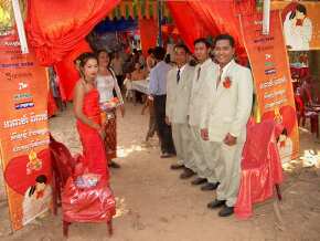 The wedding party greeting guests