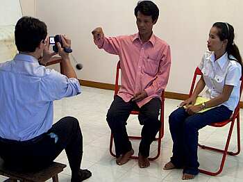 Vuth demonstrating Khmer sign language
