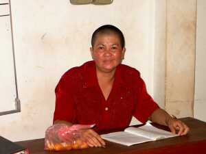 A deaf woman with her head shaved as a nun