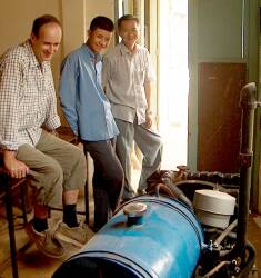 Andy (left) examining generator with staff