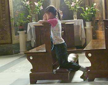Wut Ka praying at Holy Steps chapel