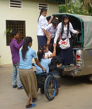 Climbing into vans to go to school