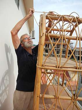 Charlie preparing to lower a bookcase