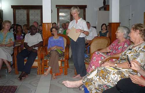 Susan Sporl opening a gift